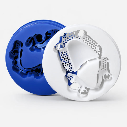 Blue and white dental wax discs with milled removable framework patterns