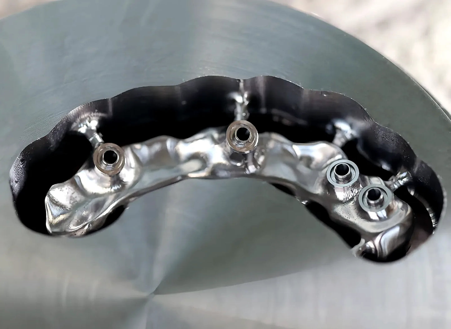 Milled dental titanium framework detail from a Grade 5 titanium alloy disc