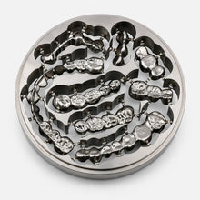 Grade 2 titanium disc with milled dental crowns and bridge restorations for CAD/CAM workflows