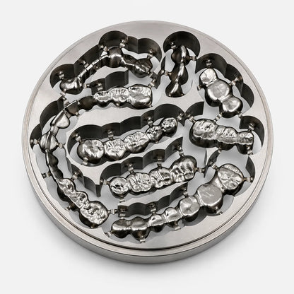Grade 2 titanium disc with milled dental crowns and bridge restorations for CAD/CAM workflows