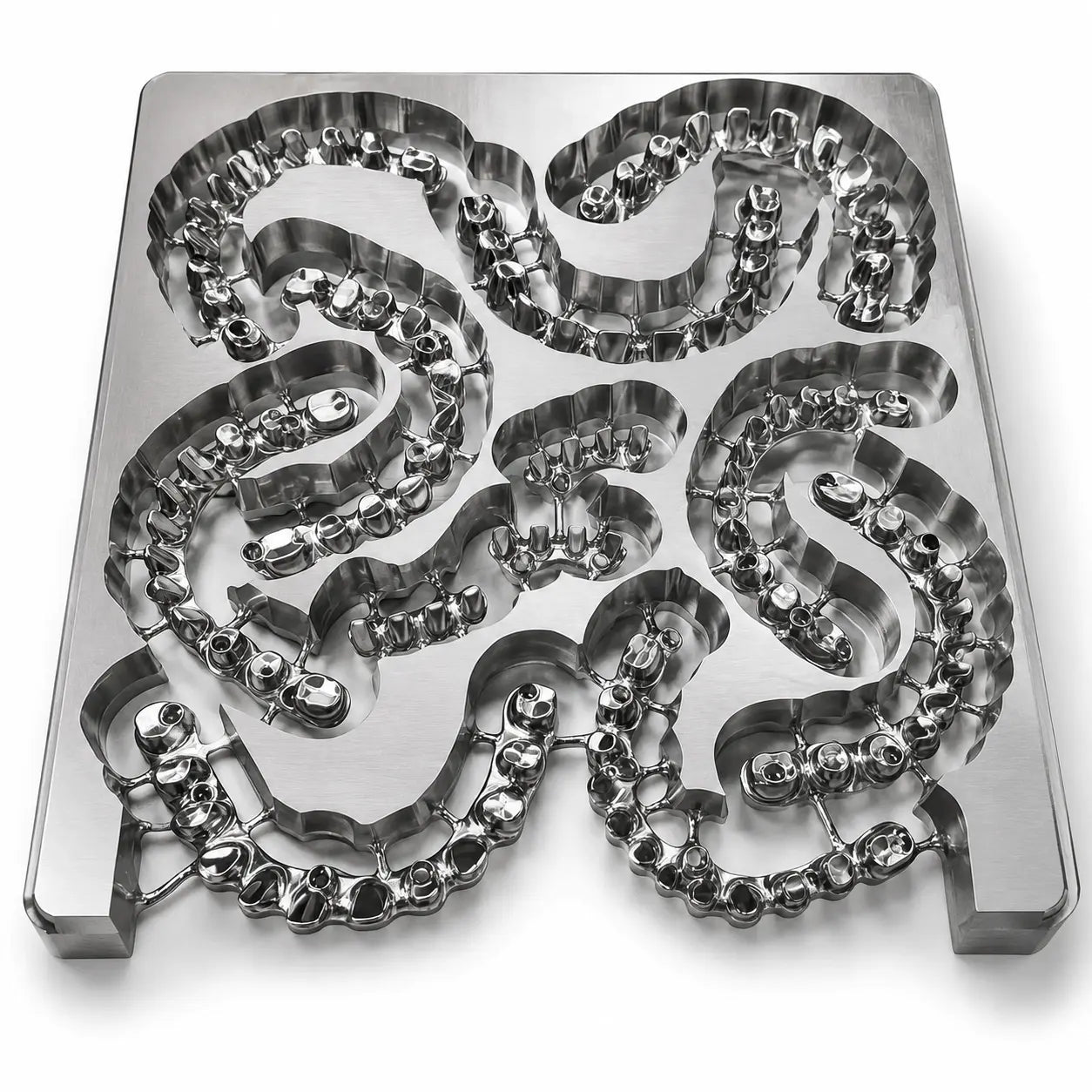 Milled Grade 5 titanium alloy 140 x 150mm blank with dental framework restorations