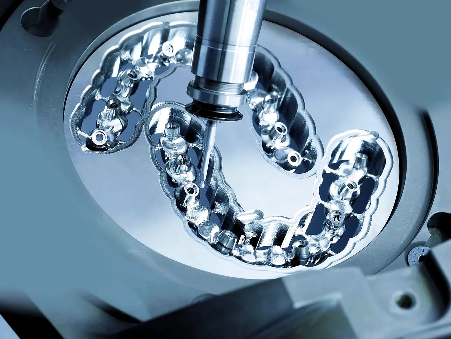 Ti-6Al-4V Grade 5 titanium alloy disc being milled in a dental CAD/CAM machine