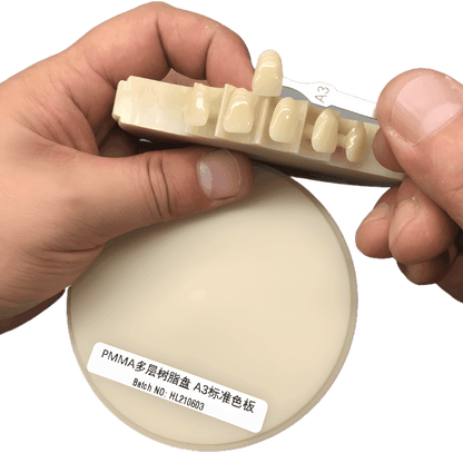 Gradient-shaded PMMA disc for creating realistic dental prosthetics