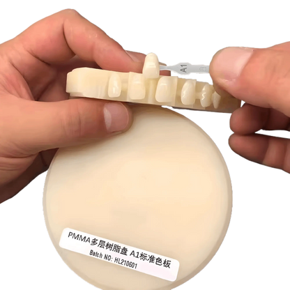 Multi-layered PMMA block for lifelike color transitions in dental prosthetics